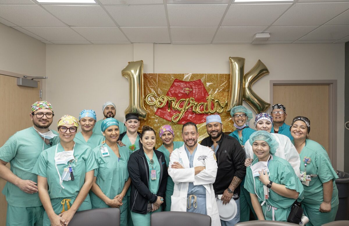 Dr. Rene Luna, a distinguished expert in Robotic Surgical Gynecology, celebrated the milestone of completing his 1,000th robotic surgical procedure on March 20, 2024. Pictured center, with his white coat on, is Dr. Luna with the proud DHR Health surgical tech team.