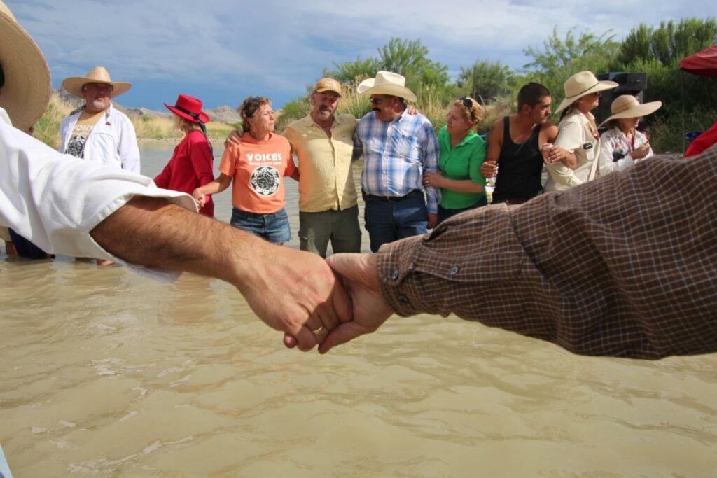Americans and Mexicans join hands across the Rio Grande, 2014. Photo by Lorne Matalon